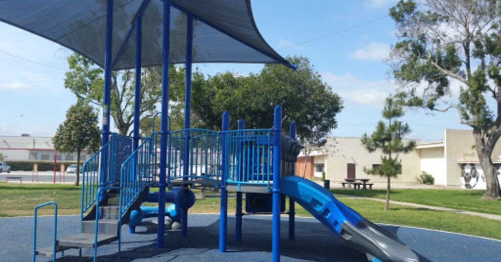 Things to do in Hawthorne at Hawthorne Memorial Park showing open green space where visitors walk, rest, and enjoy a calm outdoor setting.